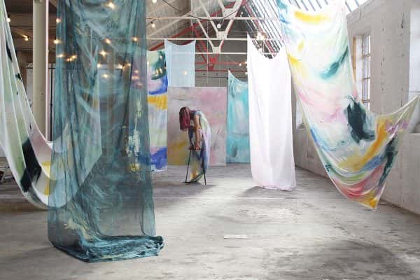 Brooke Savino - BA Fine Art work by Brooke Savino showing an installation view of a dancer amongst painted fabrics.