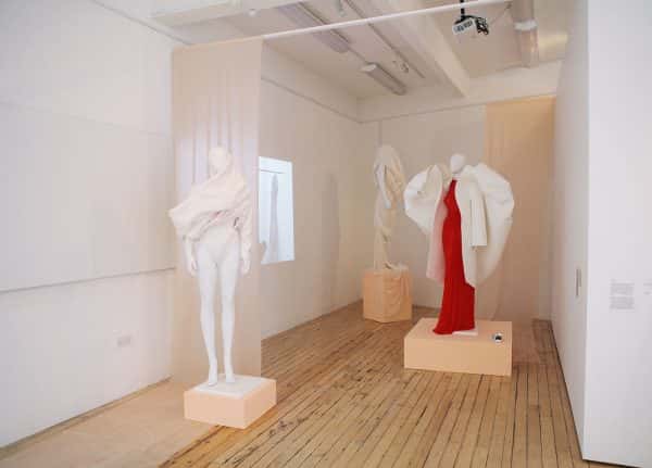 Amy Ollett - Image of mannequins with a red and white garment on