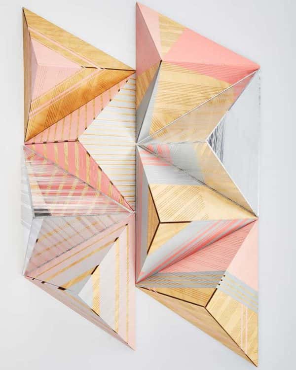 Laura Hackette - Image of hand painted wooden pyramids painting with pastel coloured shapes and lines