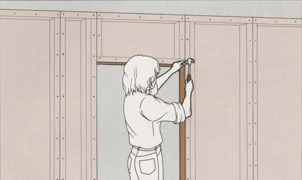  - design by Lily Troup shows a design manual style illustration in light colours with a person hammering a nail into a wall doorway