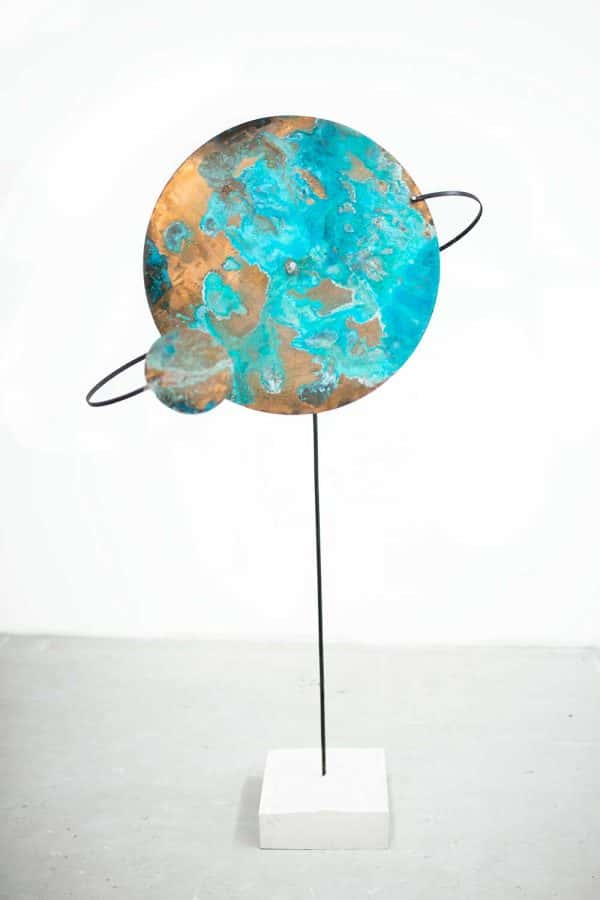 Beth Poulter - Image of a bronze sculpture of a planet designed by Beth Poulter