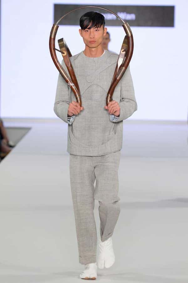 Bryan Wan - Image a model wearing a grey tailored outfit