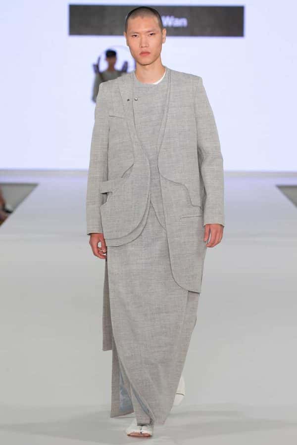 Bryan Wan - Image of a male model wearing a tailored grey outfit