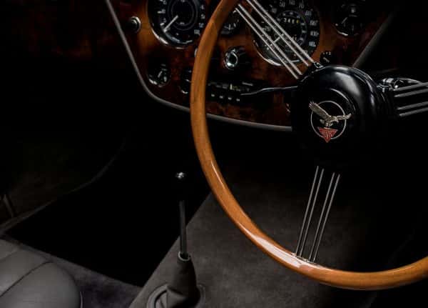 Chloe Wilson - Image of the interior of a sports car featuring the steering wheel