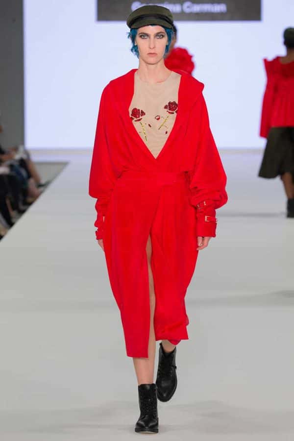 Georgina Carman - Image of a female model wearing a red garment on a catwalk