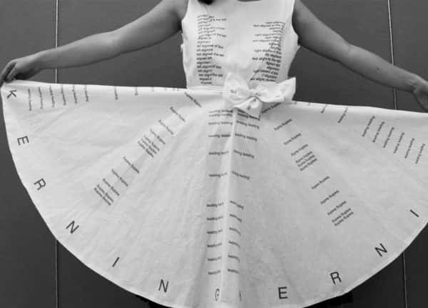 - Image of a girld holding a dress with the words Kerning printed on to the skirt