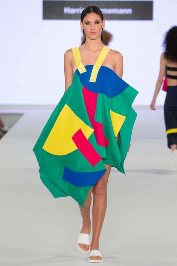 Harriet Bornemann - Image a a model wearing a garment made of bright coloured panels