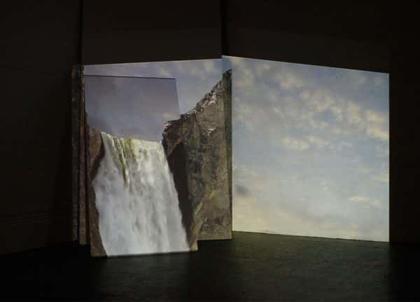 James Quinn - Image of three screens with waterfall projected onto them