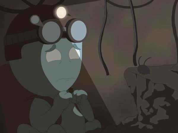  - Image of a green character in a dark room designed by NUA Animation student Sian Hayes