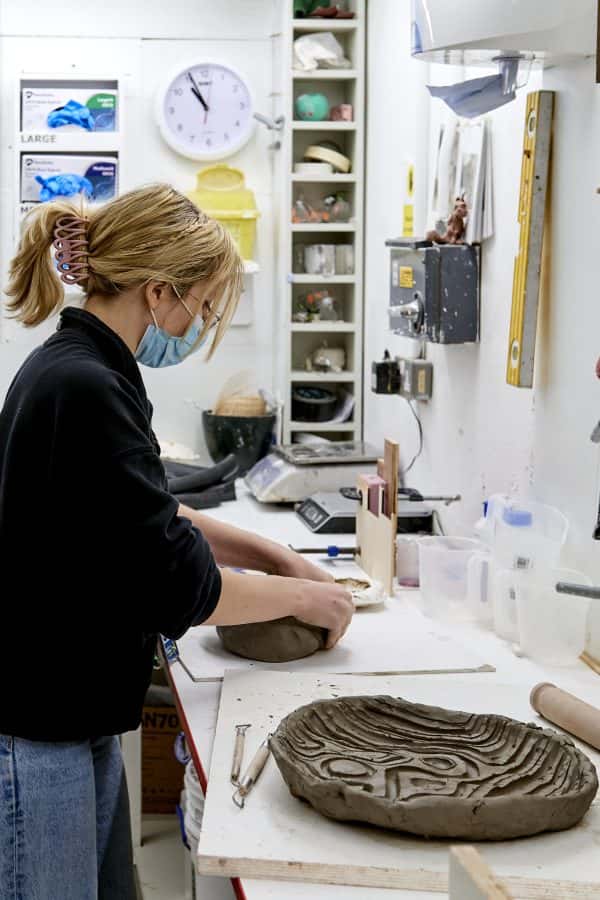  - A student in the 3D workshop creates clay moulds
