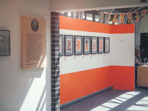Norwich Arts Centre Gallery - Image of an internal gallery space featuring an exhibtion of paperback word and orange work