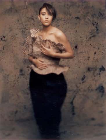Garment - Photograph of a woman in a beige sculptural top by Sue Chowles