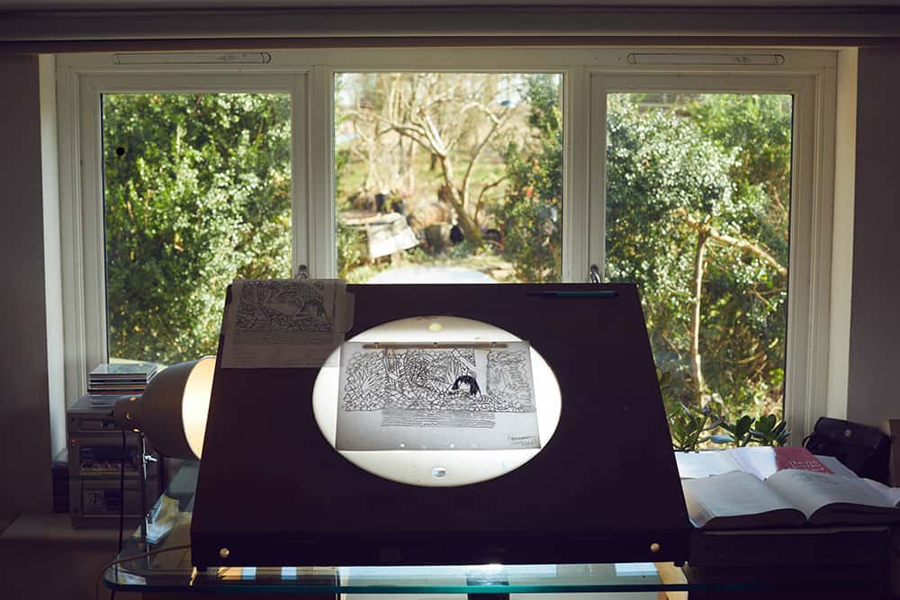 Lightbox in Suzie Hanna's animation studio in a looking out to a window full of green leaves