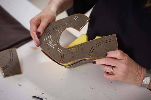 In the studio with MA Leader, Marie Brennan - Marie Brennan, MA Leader at Norwich University of the Arts holding her home-made shoe designs