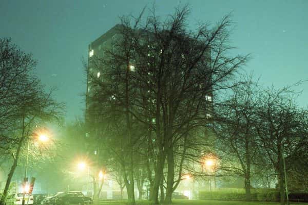Elliot Knott - Building behind some trees with bright lights by MA Photography student Elliot Knott