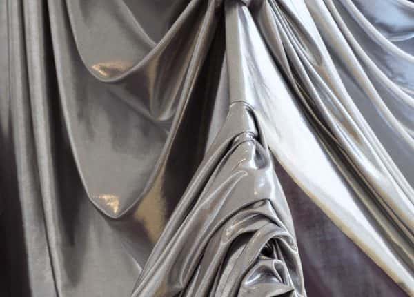 Emily Cannell, MA Fashion - Close up of silver fabric draped over a metal object