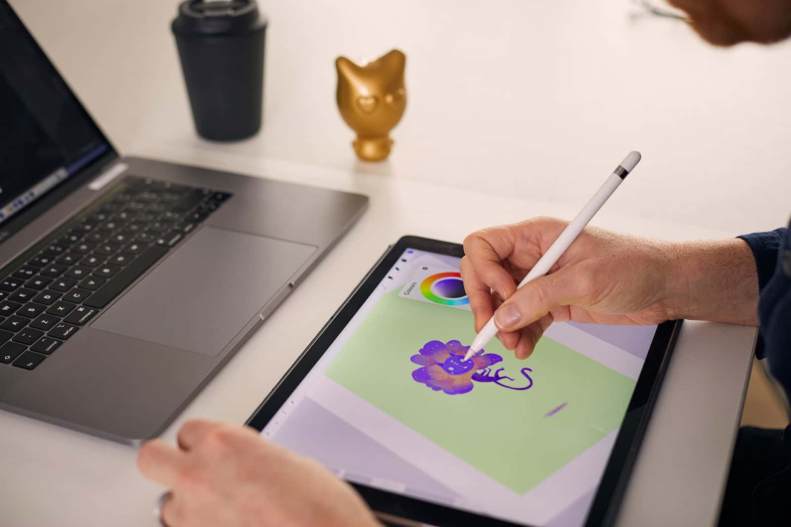 Jon Dunleavy BA Animation lecturer animates a bright character on an iPad