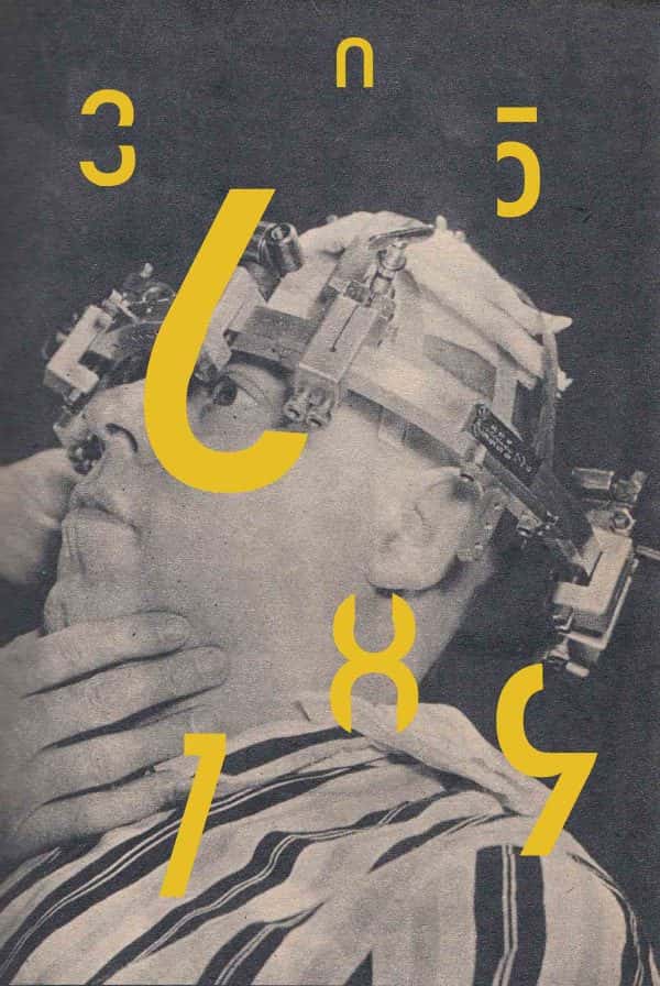  - Monochrome image of a man leaning back with a device on his head and large yellow numbers dotted around him