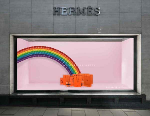 Beth Poulter - Store window visual merchandising for Hermes, featuring a pink backdrop with a rainbow. At the bottom of the rainbow are Hermes bags. By BA Fashion Communication and Promotion student Beth Poulter