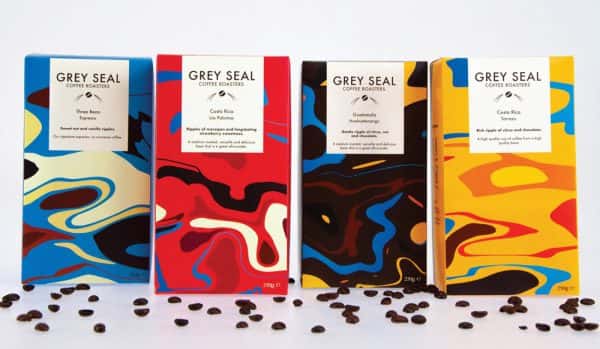 Irina Cobzas - Grey Seal coffee packaging design. Four boxes of coffee in different colours (blue, red, brown and yellow) with swirling shapes
