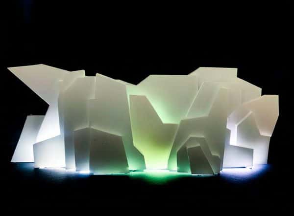 Jose Peralta - 3D structure made out of origami/geometric shapes, with areas lit white and green